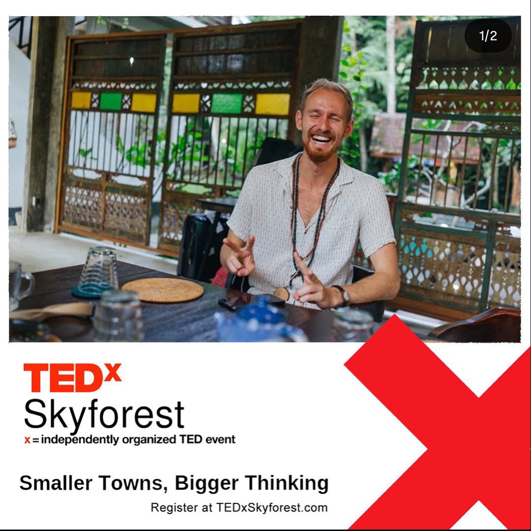 Jared laughing on stage at TEDx Skyforest — Smaller Towns, Bigger Thinking