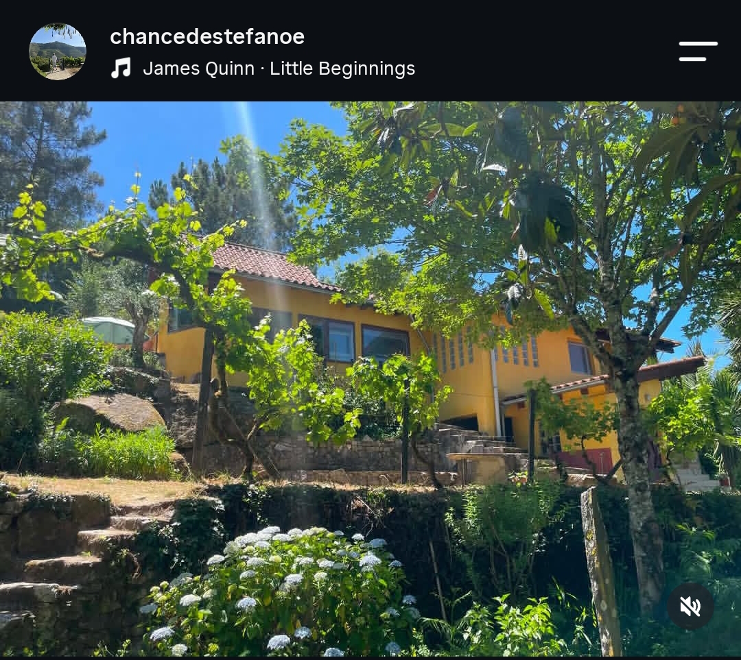 Sunlit retreat house among gardens